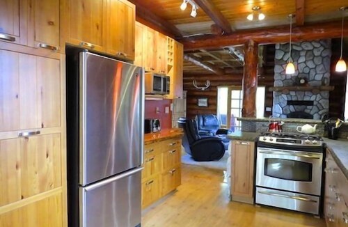 Otter Point Cottage | Cozy Rustic Log Home Living With Wood Fireplace And Hot Tub