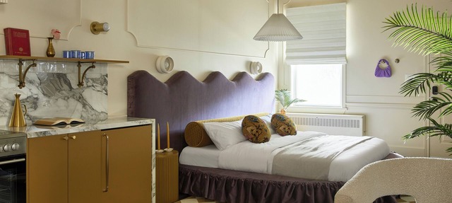 This neutral flat packs a punch with a unique and interesting feature—a round king size bed! in Stratford